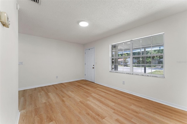 235 Ruth Blvd, Longwood, FL 32750 - spare room featuring light wood-type flooring and a textured ceiling