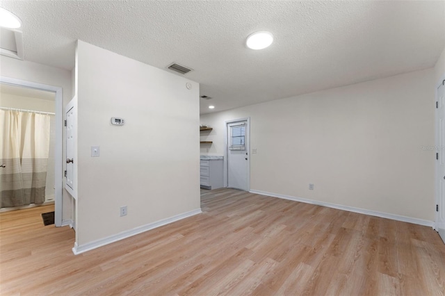 235 Ruth Blvd, Longwood, FL 32750 - empty room with light wood-style floors and a textured ceiling