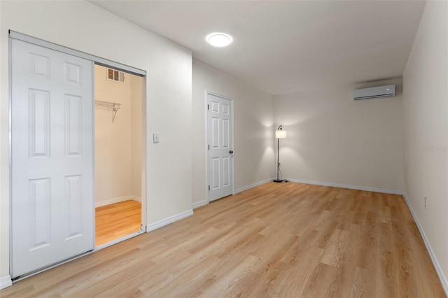 235 Ruth Blvd, Longwood, FL 32750 - unfurnished bedroom with a wall unit AC and light wood-type flooring