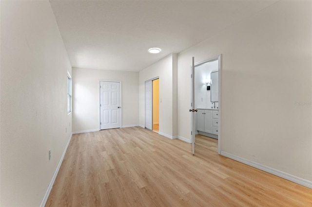 235 Ruth Blvd, Longwood, FL 32750 - unfurnished bedroom featuring light wood finished floors and ensuite bathroom