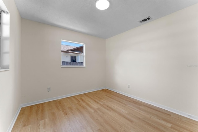 235 Ruth Blvd, Longwood, FL 32750 - empty room with light wood-style floors and a textured ceiling