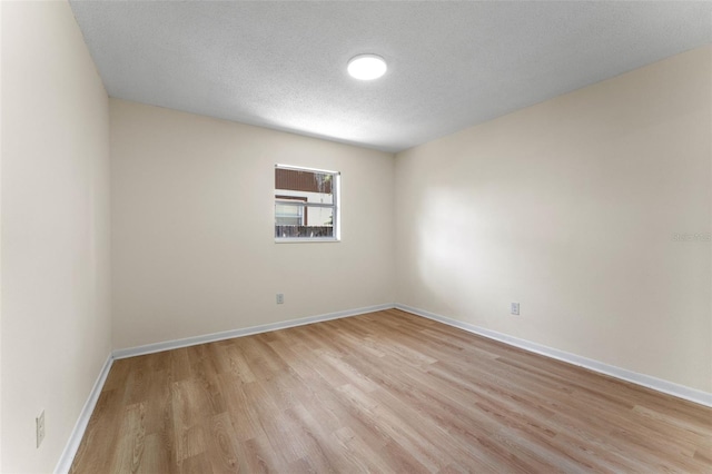 235 Ruth Blvd, Longwood, FL 32750 - empty room with light wood-style flooring and a textured ceiling