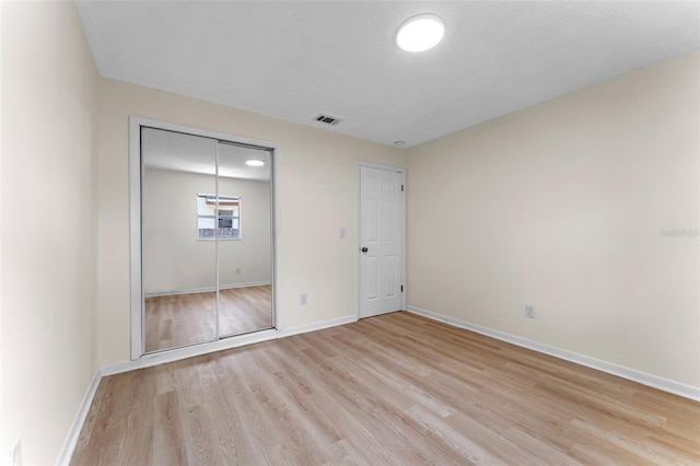 235 Ruth Blvd, Longwood, FL 32750 - unfurnished bedroom featuring light wood finished floors and a closet