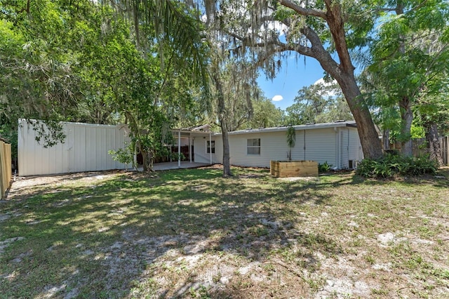 235 Ruth Blvd, Longwood, FL 32750 - fenced backyard featuring a patio