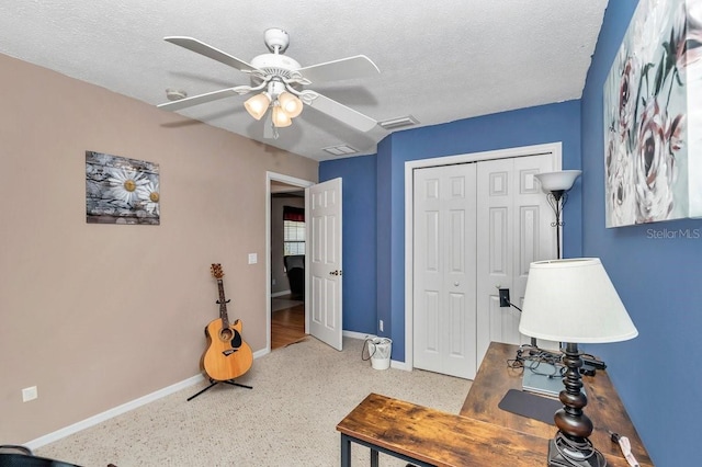 7120 N Glenridge Cir, Citrus Springs, FL 34434 - office space featuring ceiling fan, a textured ceiling, and speckle patterned floor