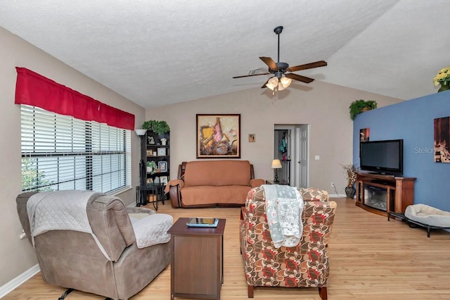 7120 N Glenridge Cir, Citrus Springs, FL 34434 - living room with lofted ceiling, light wood-style flooring, and ceiling fan