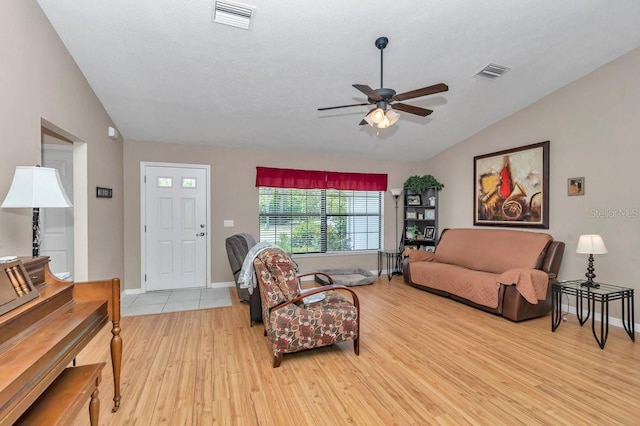 7120 N Glenridge Cir, Citrus Springs, FL 34434 - living room featuring lofted ceiling, light wood-style floors, and a ceiling fan