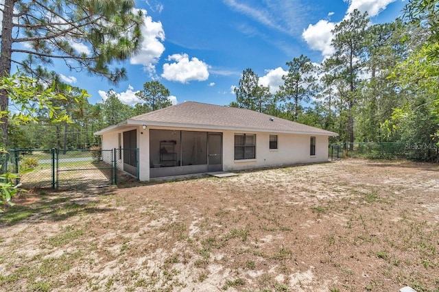 7120 N Glenridge Cir, Citrus Springs, FL 34434 - back of house with a gate, a sunroom, and stucco siding