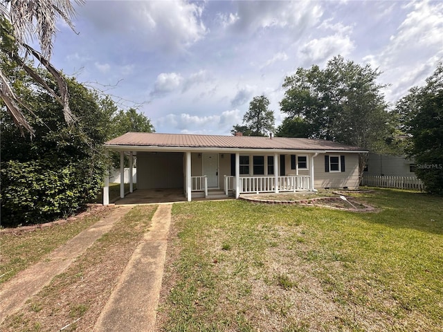4274 2nd Ave, Marianna, FL 32446 - ranch-style home with driveway, a porch, an attached carport, and a metal roof