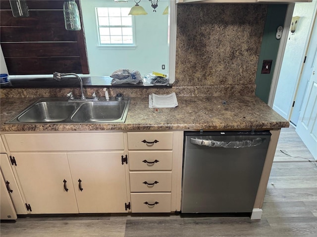 4274 2nd Ave, Marianna, FL 32446 - kitchen featuring dishwasher, light wood-style flooring, and white cabinetry