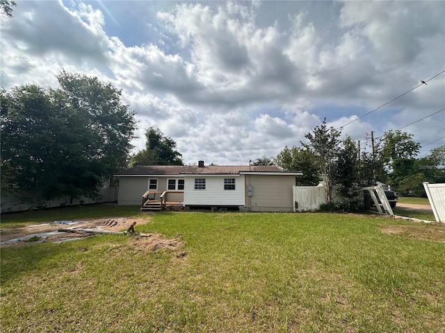 4274 2nd Ave, Marianna, FL 32446 - rear view of house featuring a metal roof