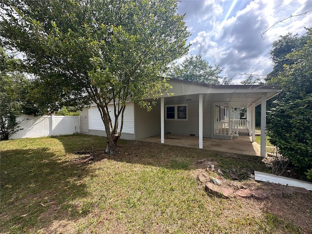 4274 2nd Ave, Marianna, FL 32446 - rear view of house with a patio area