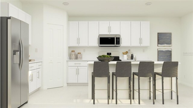 2125 Lasso Loop, Eagle Lake, FL 33839 - kitchen with stainless steel fridge, stove, white cabinets, a kitchen bar, and light countertops