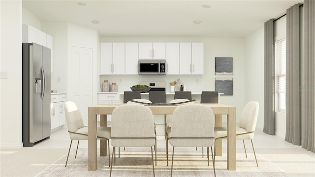 2125 Lasso Loop, Eagle Lake, FL 33839 - kitchen with stainless steel fridge with ice dispenser, white cabinets, and range