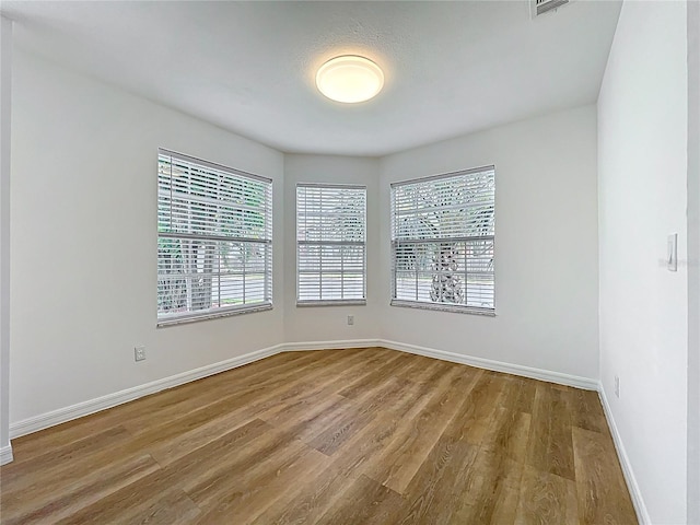 645 Stafford Ter Unit 163, Altamonte Springs, FL 32714 - empty room with wood finished floors and baseboards