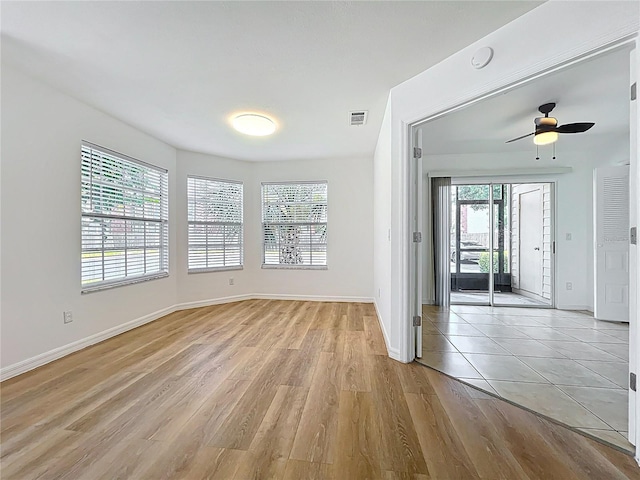 645 Stafford Ter Unit 163, Altamonte Springs, FL 32714 - spare room featuring plenty of natural light, light wood finished floors, and ceiling fan
