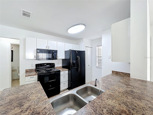 645 Stafford Ter Unit 163, Altamonte Springs, FL 32714 - kitchen featuring black appliances, white cabinets, and light tile patterned floors
