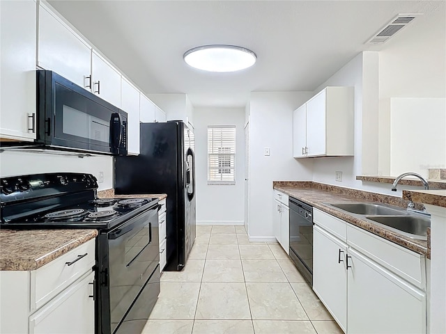 645 Stafford Ter Unit 163, Altamonte Springs, FL 32714 - kitchen featuring black appliances, white cabinets, and light tile patterned floors
