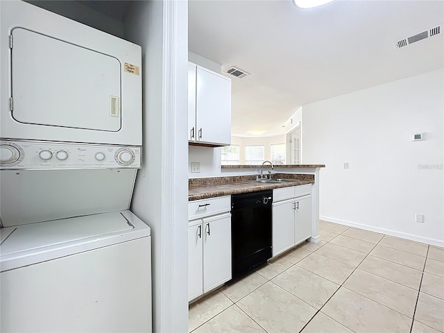 645 Stafford Ter Unit 163, Altamonte Springs, FL 32714 - laundry room with estacked washer and dryer and light tile patterned floors