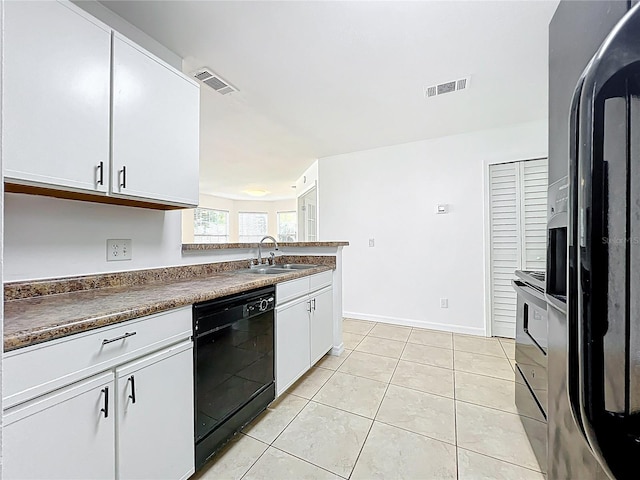 645 Stafford Ter Unit 163, Altamonte Springs, FL 32714 - kitchen featuring refrigerator with ice dispenser, black dishwasher, white cabinets, light tile patterned floors, and range