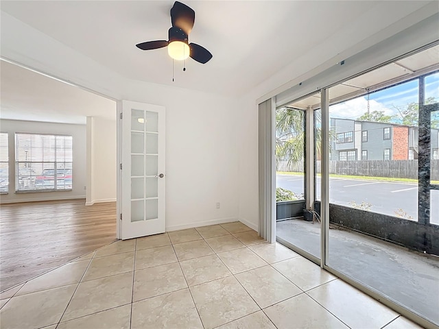 645 Stafford Ter Unit 163, Altamonte Springs, FL 32714 - empty room featuring healthy amount of natural light, light tile patterned flooring, and ceiling fan