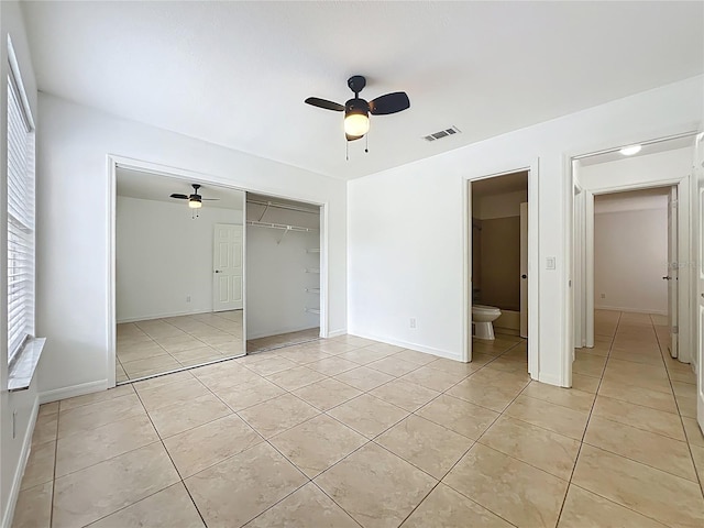 645 Stafford Ter Unit 163, Altamonte Springs, FL 32714 - unfurnished bedroom featuring light tile patterned flooring, a closet, and a ceiling fan