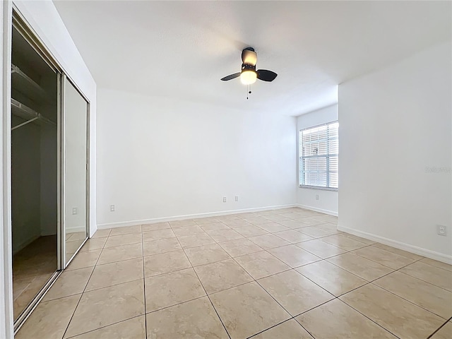 645 Stafford Ter Unit 163, Altamonte Springs, FL 32714 - unfurnished bedroom featuring light tile patterned floors, a ceiling fan, and a closet