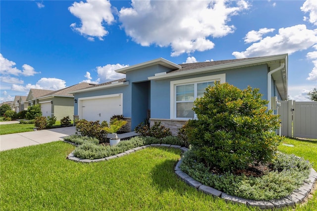 633 Greymount St, Davenport, FL 33837 - view of front of property featuring stucco siding, concrete driveway, an attached garage, and stone siding