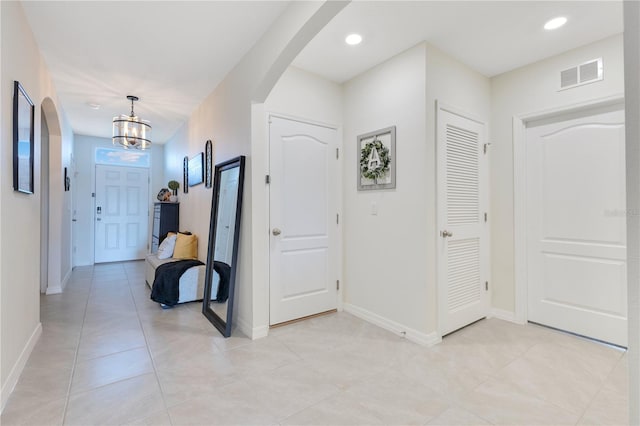 633 Greymount St, Davenport, FL 33837 - entryway featuring arched walkways, a chandelier, light tile patterned floors, and recessed lighting