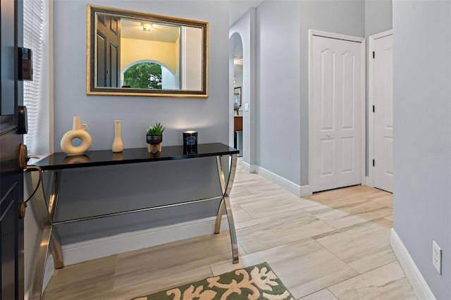 6027 Strada Isle Way, Orlando, FL 32835 - corridor with arched walkways and baseboards