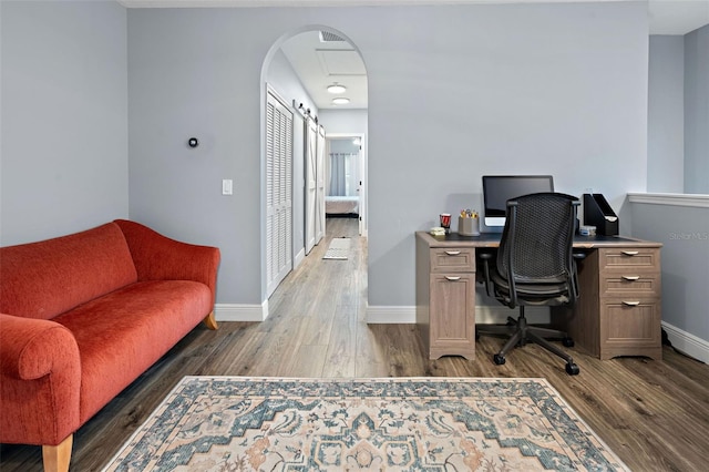 6027 Strada Isle Way, Orlando, FL 32835 - office area with wood finished floors and arched walkways