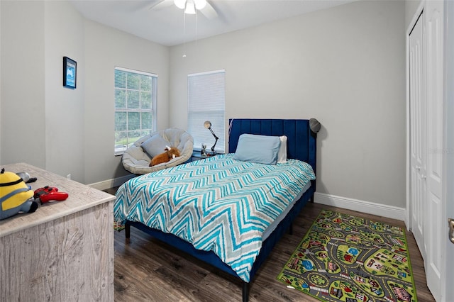 6027 Strada Isle Way, Orlando, FL 32835 - bedroom with wood finished floors, a closet, and ceiling fan