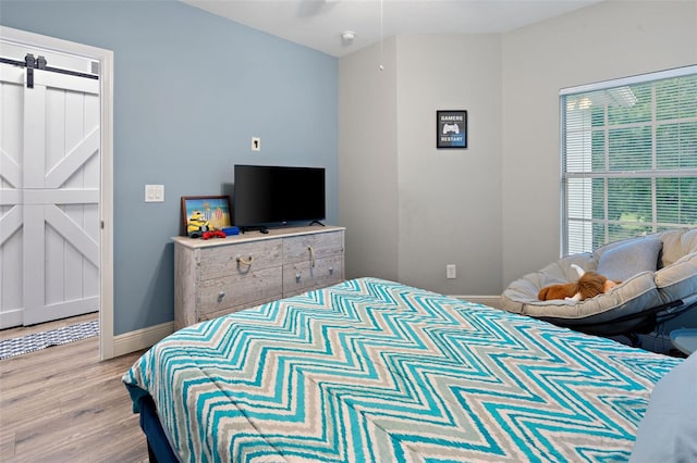 6027 Strada Isle Way, Orlando, FL 32835 - bedroom featuring wood finished floors and baseboards