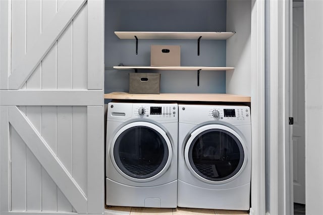 6027 Strada Isle Way, Orlando, FL 32835 - laundry area with washer and clothes dryer