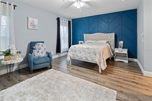 6027 Strada Isle Way, Orlando, FL 32835 - bedroom with wood finished floors and a ceiling fan