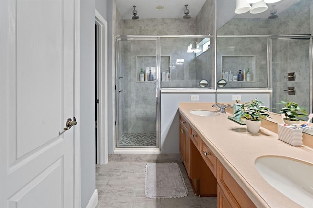 6027 Strada Isle Way, Orlando, FL 32835 - bathroom with a stall shower, double vanity, and tile patterned floors