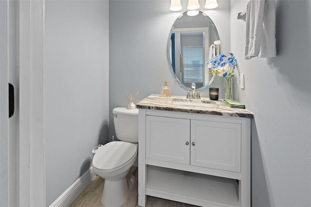 6027 Strada Isle Way, Orlando, FL 32835 - bathroom with vanity and wood finished floors