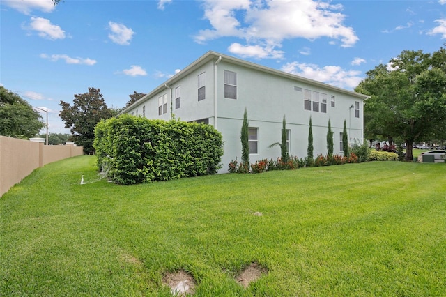 6027 Strada Isle Way, Orlando, FL 32835 - view of property exterior with stucco siding