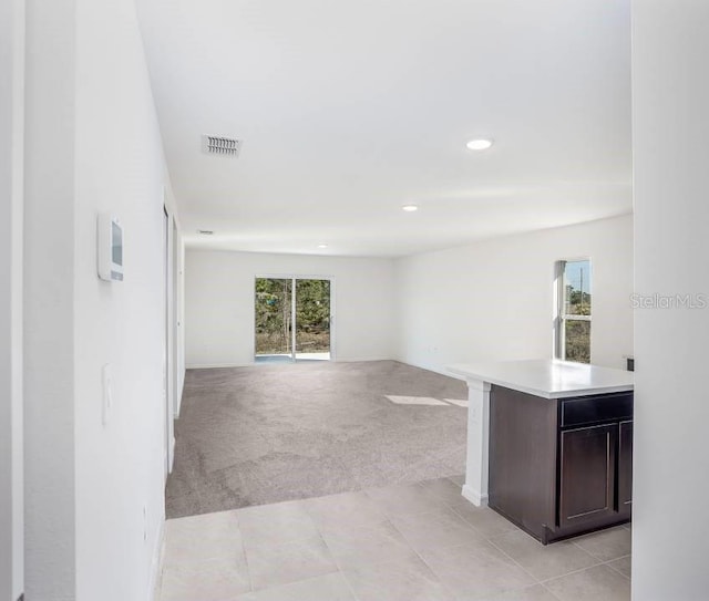 230 Locus Pass Crse, Ocala, FL 34472 - hall featuring light carpet, recessed lighting, and light tile patterned flooring