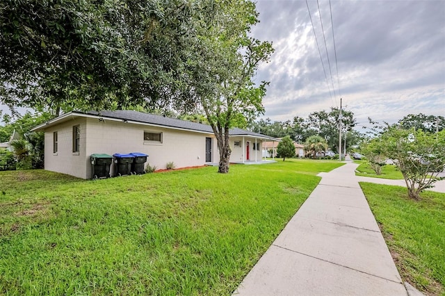 4559 W Gore Ave, Orlando, FL 32811 - view of front of house featuring a front lawn