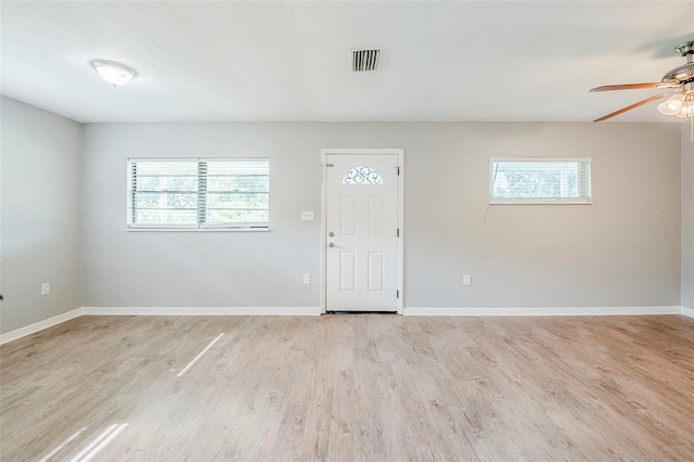 4559 W Gore Ave, Orlando, FL 32811 - entryway featuring healthy amount of natural light, a ceiling fan, and light wood-type flooring