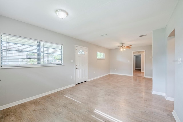 4559 W Gore Ave, Orlando, FL 32811 - foyer entrance with light wood-type flooring and a ceiling fan