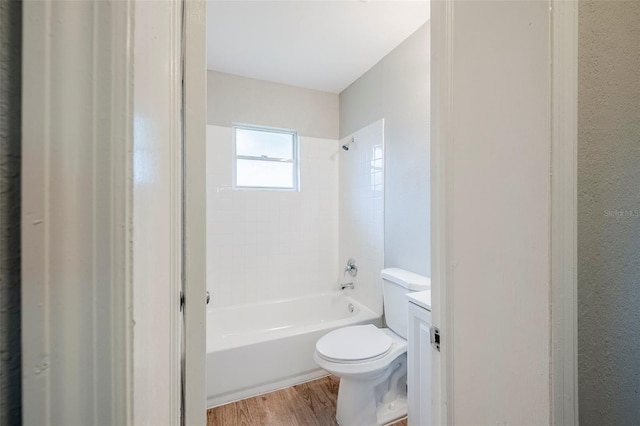 4559 W Gore Ave, Orlando, FL 32811 - bathroom featuring wood finished floors, shower / washtub combination, and vanity