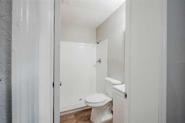 4559 W Gore Ave, Orlando, FL 32811 - full bath with a stall shower, wood finished floors, and vanity