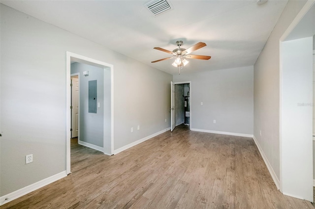 4559 W Gore Ave, Orlando, FL 32811 - spare room with electric panel, light wood-type flooring, and ceiling fan