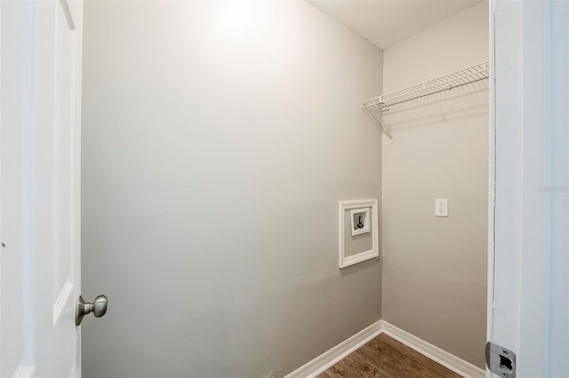 4559 W Gore Ave, Orlando, FL 32811 - laundry area with washer hookup and wood finished floors