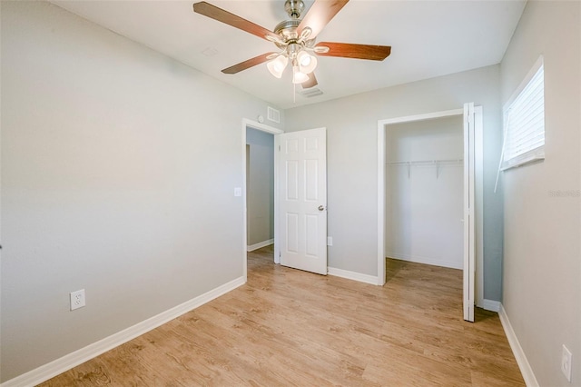 4559 W Gore Ave, Orlando, FL 32811 - unfurnished bedroom featuring a closet, light wood-type flooring, and a ceiling fan
