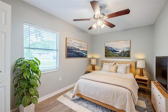 4559 W Gore Ave, Orlando, FL 32811 - bedroom featuring wood finished floors and ceiling fan