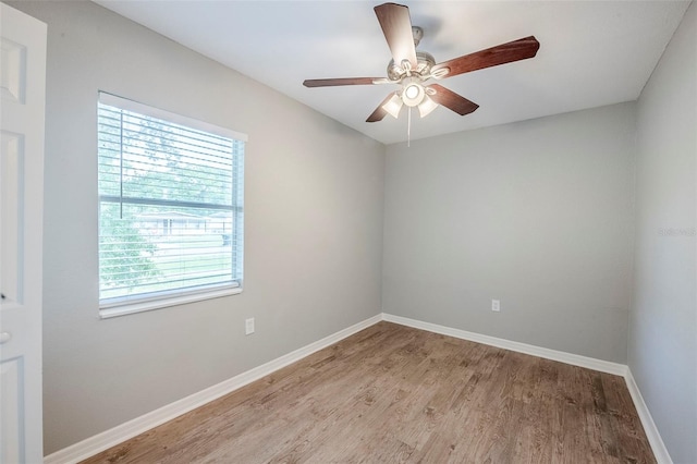 4559 W Gore Ave, Orlando, FL 32811 - unfurnished room with light wood-style flooring and ceiling fan