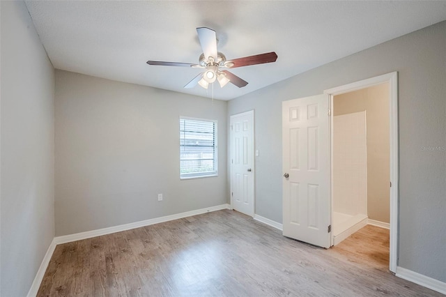 4559 W Gore Ave, Orlando, FL 32811 - unfurnished bedroom with wood finished floors, a closet, and a ceiling fan